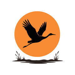 Obraz premium Minimalist flying bird silhouette vector art featuring a stork or heron soaring across an orange sunset sun with swamp grass for wildlife preservation logo, poster, or t-shirt print design