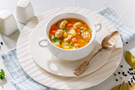 Clear American chicken meatball soup with veggies