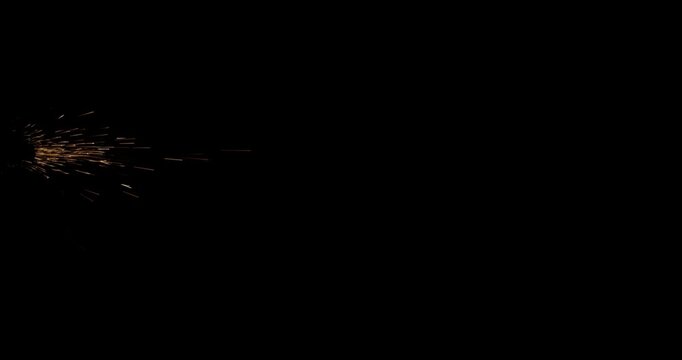 Glowing metal dust sparks flying in dark space with dynamic light effect