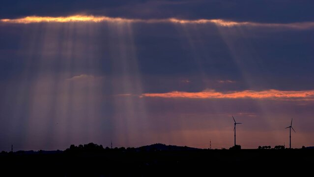 Sun rays break through the evening sky