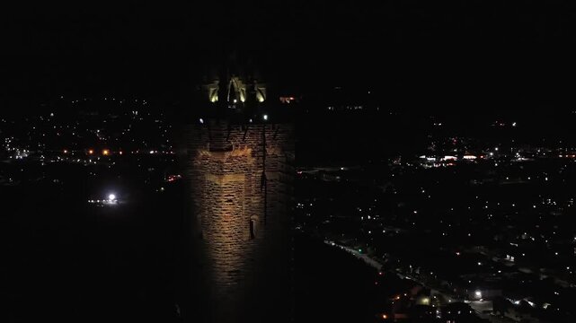 Beautiful Cinematic NIGHT aerial view of the National Wallace Monument Aerial View Over Stirling, Scotland &ndash; Historic Landmark and Scenic Town Landscape