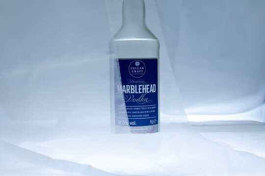 Bottle of Marblehead Vodka veiled behind a sheer white fabric with soft lighting on a white background. Ukraine, Zhytomyr, July 29, 2026