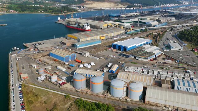 Aerial View of Heavy Industrial Seaport Terminals, Fertilizer Processing Plants, and Chemical Bulk Cargo Ships at the Port of Avil&eacute;s in Asturias, Spain