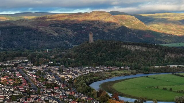 Beautiful Cinematic aerial view of the National Wallace Monument Aerial View Over Stirling, Scotland &ndash; Historic Landmark and Scenic Town Landscape