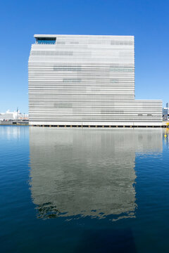 Munch Museum building reflecting in Oslo fjord waters