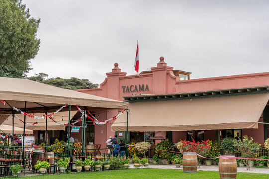 Ica, Peru, July 04, 2026: Exterior of Tacama wine tourism destination in Ica, Peru, featuring traditional architecture, gardens, outdoor seating and decorative barrels.