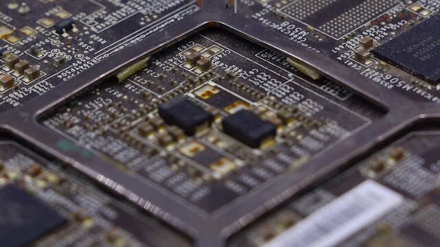 Close-up of a detailed electronic circuit board surface. Ideal for technology, computing, and industrial design projects.