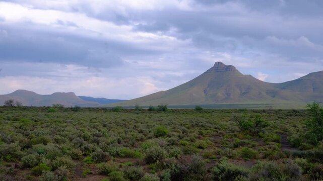 Slow pan across a dramatic flat topped mountain range
