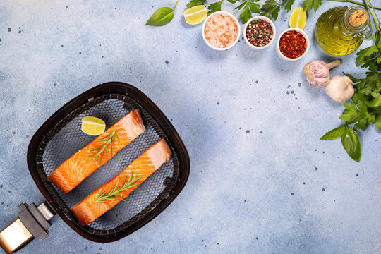 Raw salmon fillets preparing for air fryer cooking