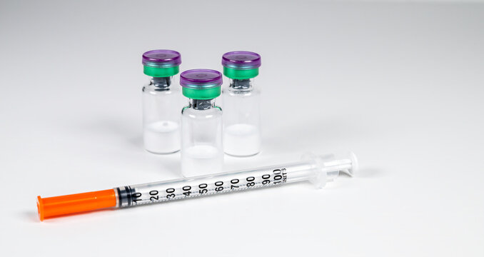 Peptide vials and syringe(s).