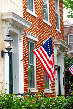 Historic Capitol Hill townhouse featuring American flag and elegant brick residential architecture in Washington DC