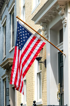 American flag displayed on historic Capitol Hill townhouse in Washington DC residential neighborhood