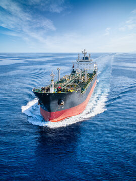 Aerial view of a large tanker for crude oil or chemical goods traveling fast over the ocean