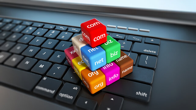 Domain name cubes standing on laptop computer keyboard. 3D illustration