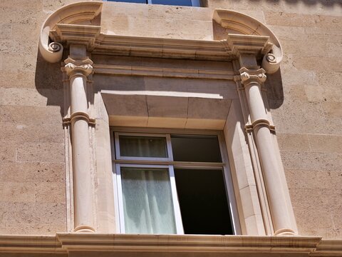 Historic Stone Window Frame with Classical Columns Detail