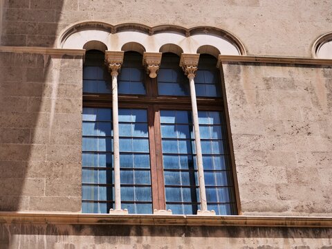 Gothic Arched Window with Slender Columns and Blue Glass