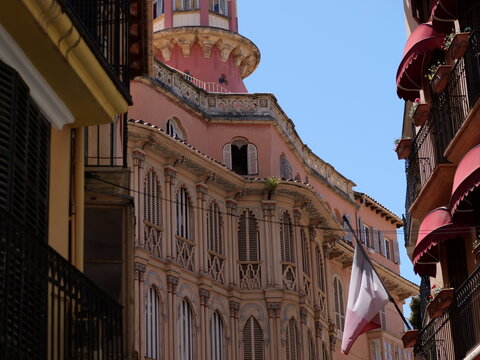 Ornate Modernist Building and Tower Framed by Narrow Palma Street