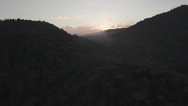 Aerial sunrise over Guag&uuml;&iacute; Mountain, La Vega, Dominican Republic with morning fog