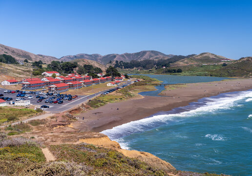 Panoramic view of the coastline at Rodeo Beach situated below the historic Fort Barry military barracks within the rugged Marin Headlands region.