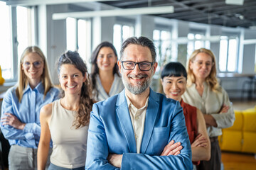 Obraz premium Business leader smiling with diverse corporate team members