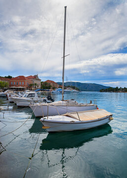Boats moored in the scenic harbor of Stari Grad town, Hvar Island, Croatia