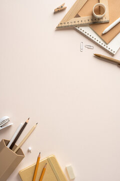 Back to school flatlay with neutral stationery pencil notebook and ruler on a clean vertical desk for inspiration
