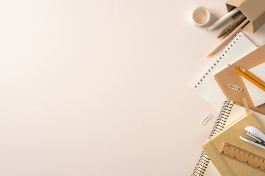Back to school flat lay with neutral stationery, notebooks, pencils and workspace for study planning