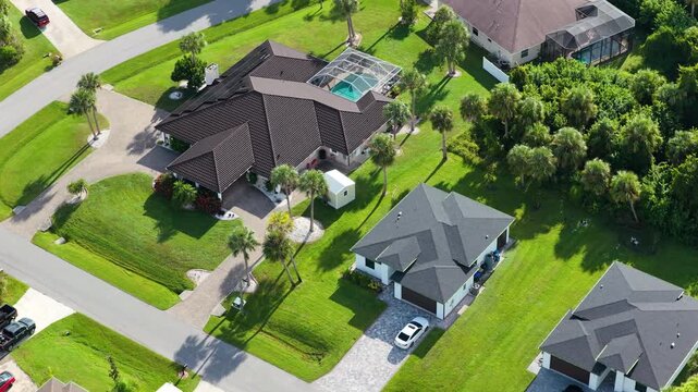 Suburban housing development with rows of modern houses and clean streets, illustrating suburban planning, population growth and middle class residential environment.