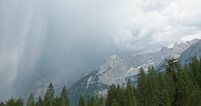 Dramatic rainstorm moving over the italian dolomites mountains