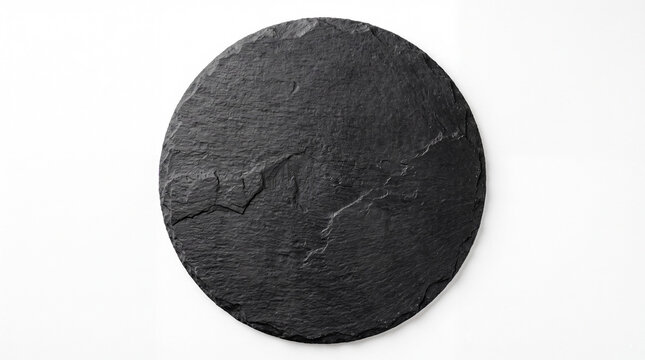 Top view of a circular black slate stone platter with a rough textured surface isolated on a plain white background for food presentation or decor