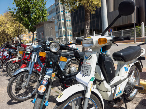 TAVERNES BLANQUES, SPAIN - JUNE 14, 2026.Classic Motovespa Vespino mopeds lined up at a retro vehicle rally in Spain with a focus on a white moped in the foreground