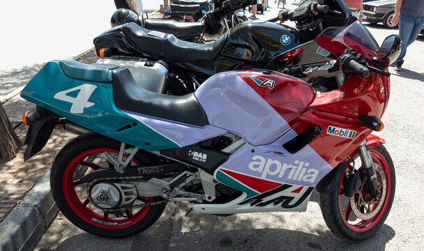 TAVERNES BLANQUES, SPAIN - JUNE 14, 2026.Retro Aprilia sport motorcycle parked at a vintage vehicle gathering in Spain on a sunny day