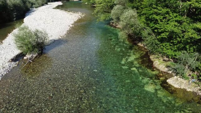 Aerial drone view of the Neretva river flowing through the landscape.