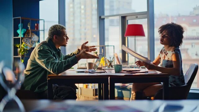 Man woman arguing office table. Frustrated colleagues clash over work meeting.