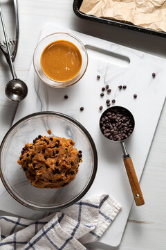 A bowl of mixture for making peanut butter chocolate chip energy balls.