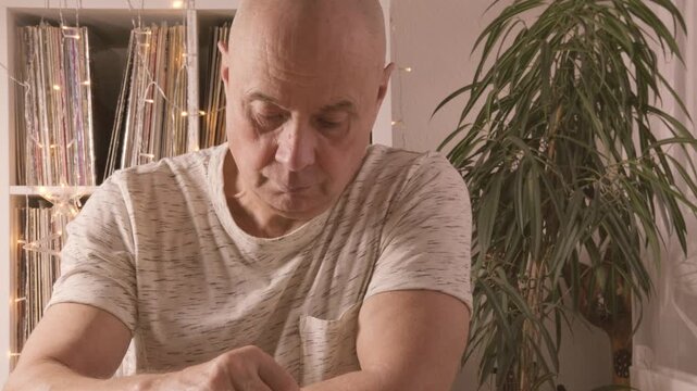 senior man focused on solving sudoku puzzle on wooden board, Brain exercise, cognitive health, and mental agility in mature age, mental stimulation, brain health