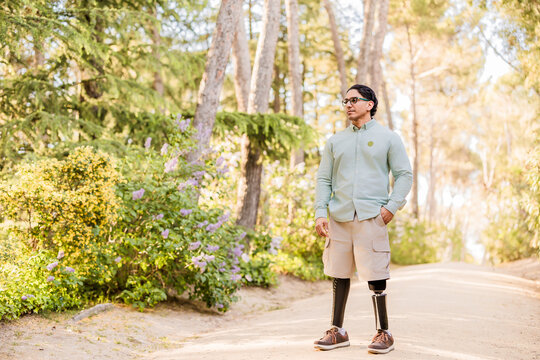 Latino man with prosthetic legs enjoying nature