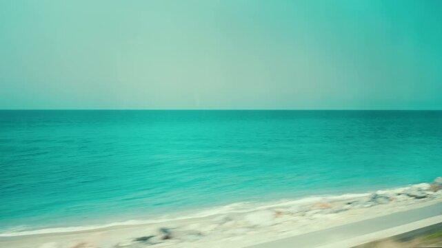 The Italian sea off Calabria, seen from the window of a moving train