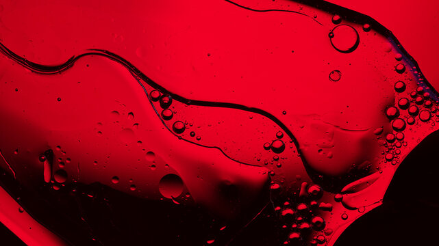 Abstract red liquid background with oil bubbles and fluid art textures