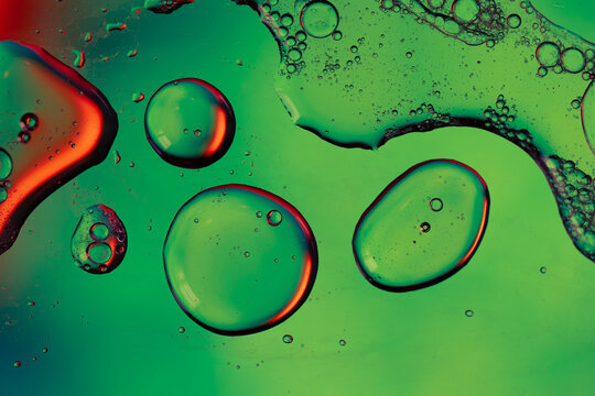 Green and red oil and water surface texture