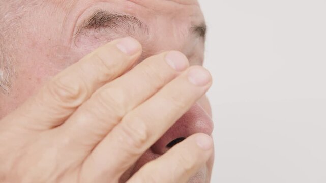 Close up mature senior man, fatigue syndrome eye pain symptoms, including strain, allergies, blocked, lacrimal duct, severe irritated eye conditions, corneal ulcers, tear gland, ocular health
