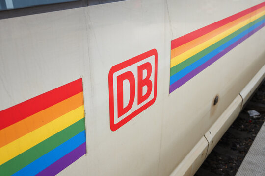 MUNICH, GERMANY - 23. April 2026: Deutsche Bahn logo sign with rainbow flag colors on ICE intercity train. Celebration of tolerance, human rights, diversity and cultures on a railway vehicle.