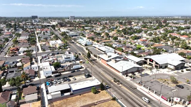 Long Beach, California, USA - Aerial Pullback View of Wrigley and Bixby Knolls Residential Neighborhood on Spring St on a Sunny Day