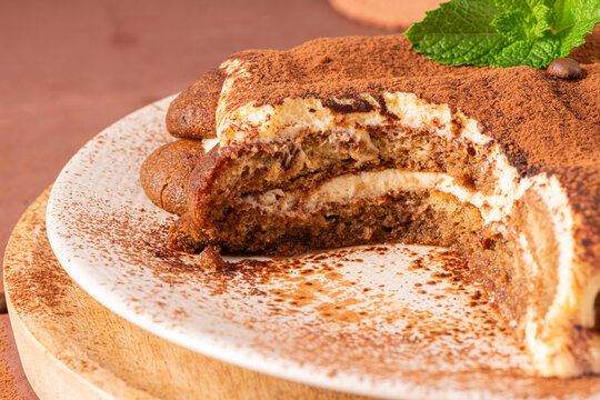 Delicious homemade tiramisu cake topped with cocoa