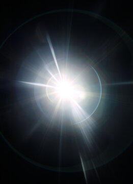 warm light beam flare on black background, dazzling radiance