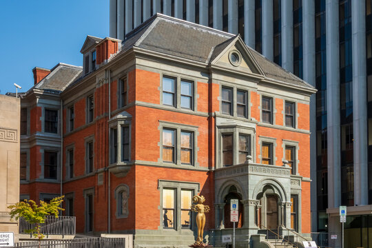 Newark, NJ - US - Jul 26, 2026 The historic Ballantine House features red brick architecture, ornate grey trim, large windows, and a prominent decorative entryway in a sunny urban setting.
