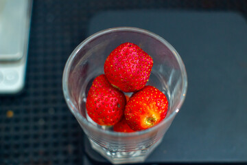 fresh strawberry in a clear glass and healthy with full nutrition of organic in a table of kitchen bar  © Mr. Frost