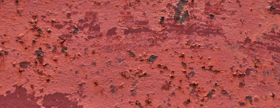 Rust spreads across metal in rich orange and brown tones, textured and weathered.