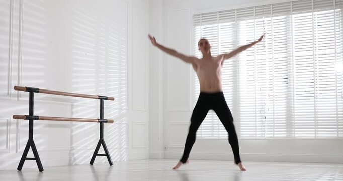 Professional dancer practicing moves in dance studio