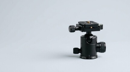 Fototapeta premium Black Tripod Ball Head Accessory for Professional Photography Equipment Setup